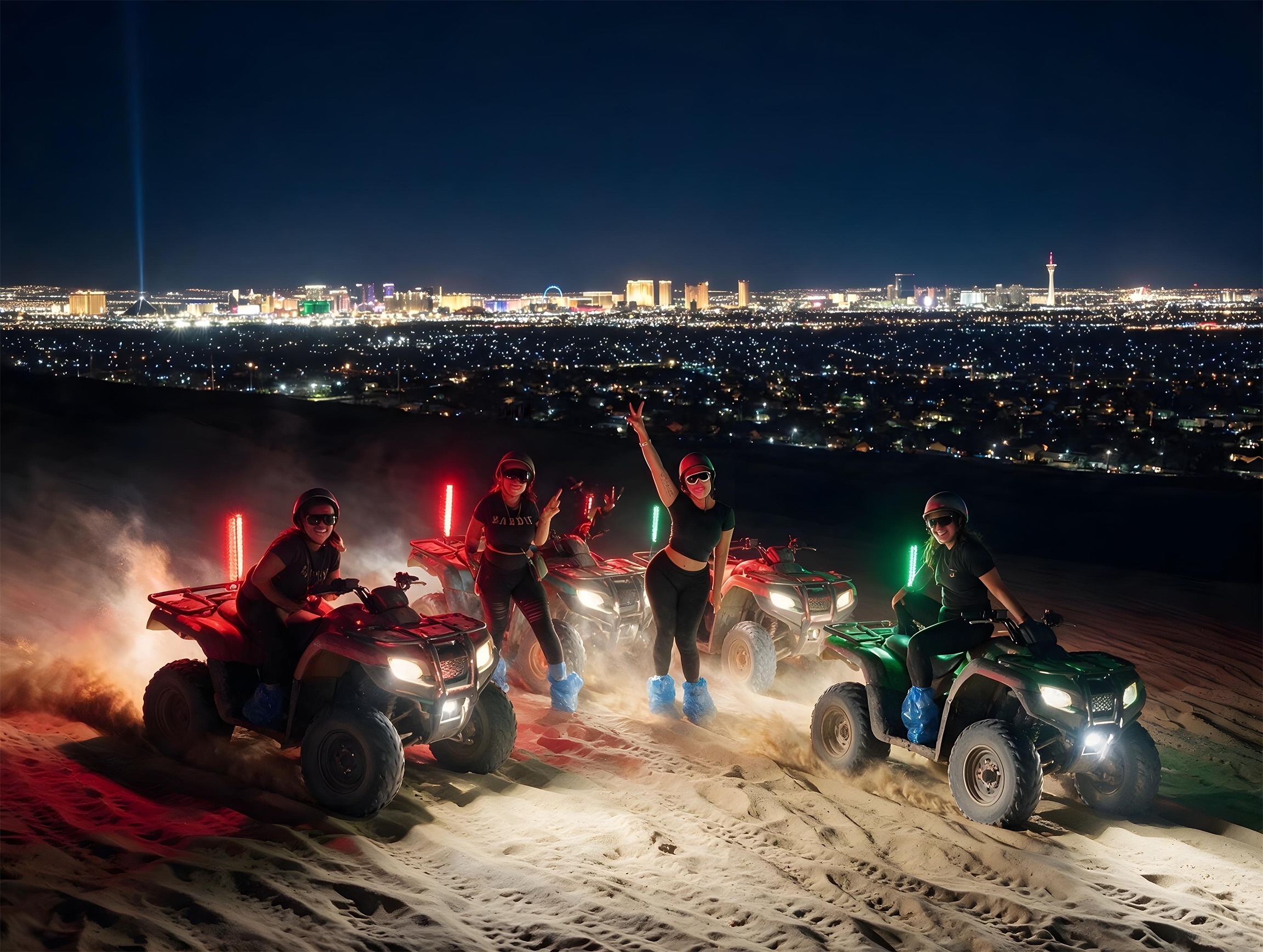 Riders parked on the dunes with the Strip skyline behind